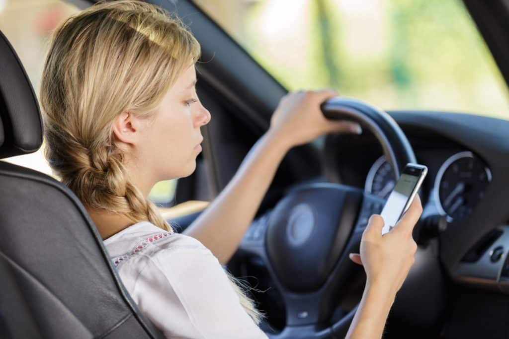 Girl texting and driving - Original
